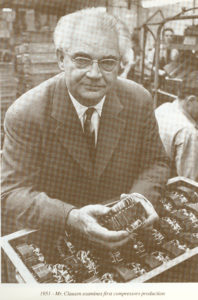 Mads Clausen holding a compressor in 1951