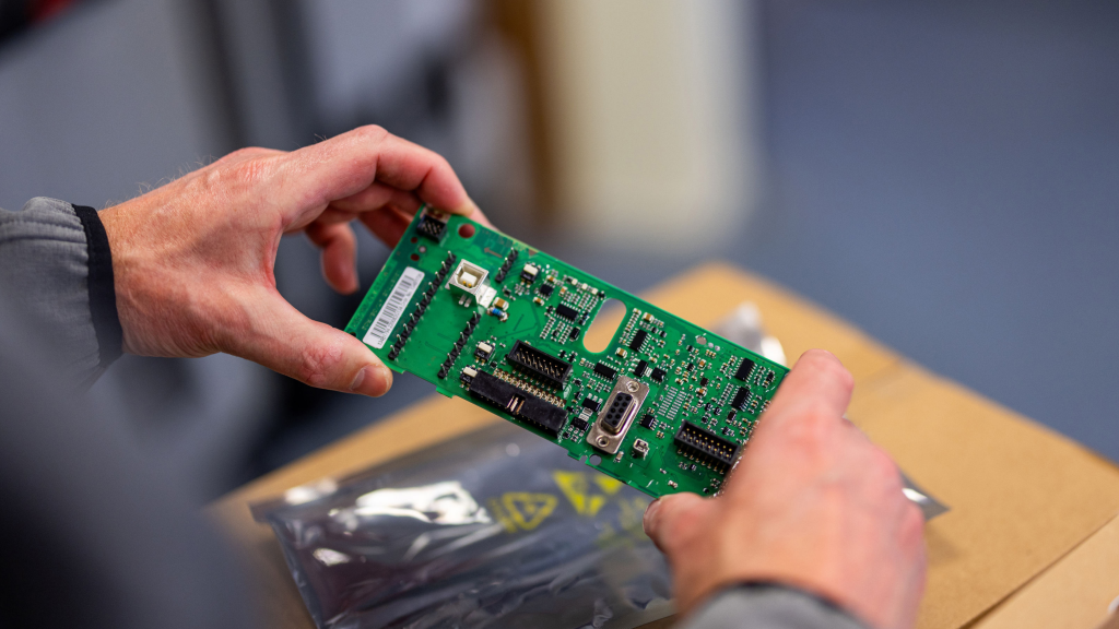 Danfoss Drives DrivePro representatives handling replacement parts. Maintenance, Repair and Operations (MRO) plans available from LED Controls.